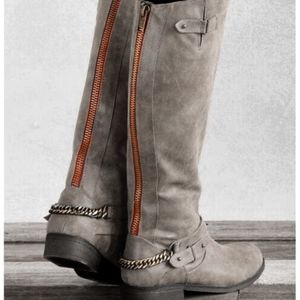 steve madden boots with red zipper up the back